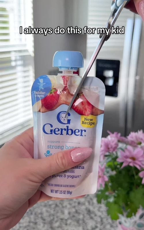 Frozen fruit puree = no mess snack for kids. I keep these ready in the freezer and just grab one when needed. #momhack #kidssnacks #parentingtips #foodhack #toddlermom