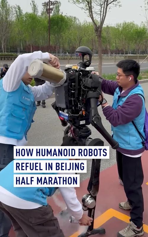 At the 2026 Beijing E Town half marathon, robots were serviced at aid stations along the course. The key tasks were rapid battery swaps and cooling to keep them running smoothly. Watch how a robot is refueled in just 40 seconds! #Robotics #Beijing #HumanoidRobots #RobotMarathon