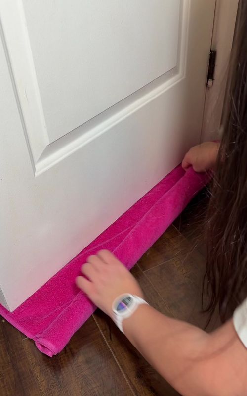 Life Hack 🚪❤️🚪 Towel under the door cuts noise, light & odors. Quick, easy, no tools 🤍 #lifehack #useful #momhacks #momlife #parentingtips