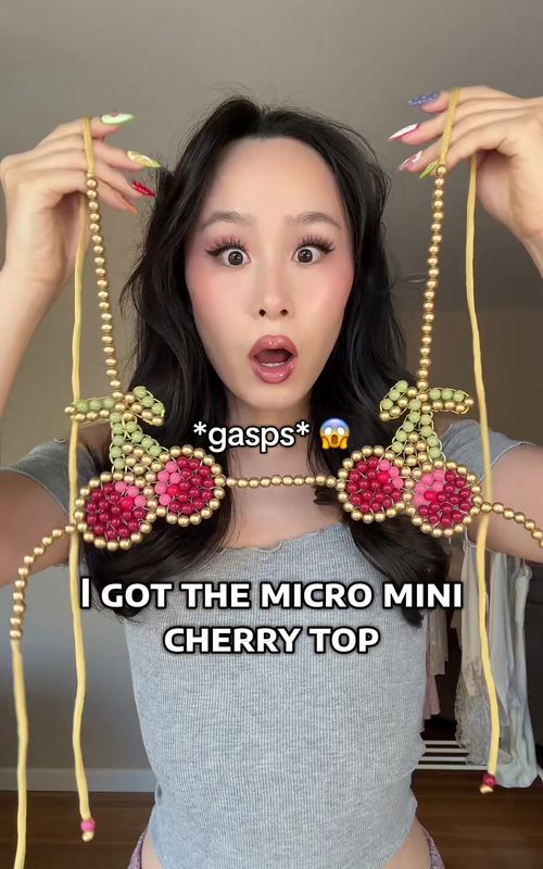 This is crazyyy 👀 style this micro mini cherry top with me in part 2! 🍒 #microminitop #cherrytop #coachellaoutfit #andibagus #beadedbikini tiniest beaded cherry bikini top