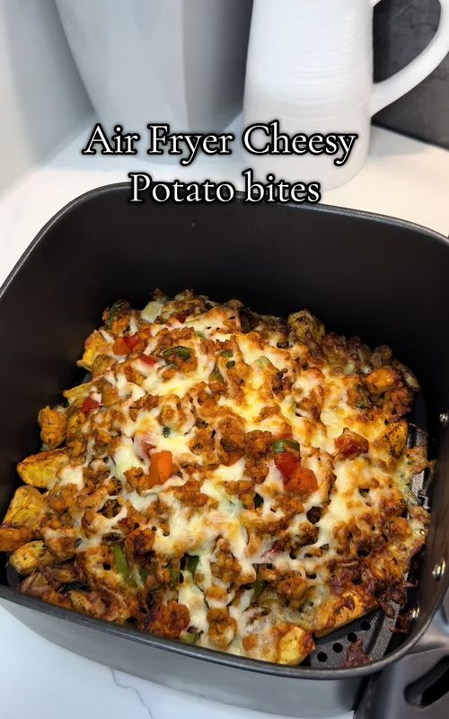 Easy Air Fryer Cheesy Potato bites😍🤤 ✨ ingredients  - Potatoes  - Paprika - Garlic Granules  - Chicken Seasoning  - Olive oil spray  - Cooked Chicken mince (can use beef) - Cheese ✨ method 1. Get some potatoes and cut them into small cubes.  2. Add salt, paprika, garlic granules and chicken seasoning.  3. Mix together with hands.  4. Spray with olive oil spray.  5. Put in air fryer for 7-8 minutes on 200 degrees.  6. Take out and add your cooked chicken mince & cheese.  7. Put back in air fryer for 3 mins.  8. Enjoy😍 So quick and easy and taste amazing 🫶 #easyrecipe #quickmeals #airfryerrecipes #dinnerideas #pizzalover 