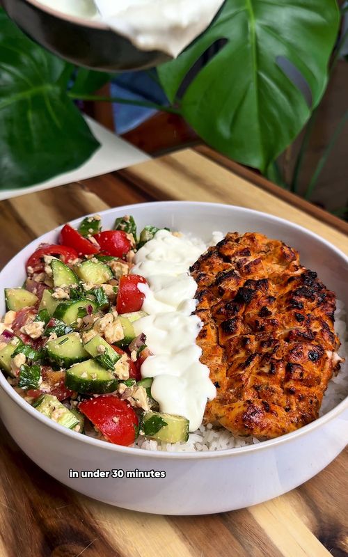 Mediterranean lemon chicken bowl 🍋🍅  You can find the full written recipe on my Recipe Portal 🙌 Macros per serve: 58g protein  27g fat 73g carbs 769 calories per serve 💪  Ingredients for 2 servings 👨‍🍳  For the chicken 🍗  400g Chicken Breast 3 Tbsp Greek Yoghurt 1 Lemon 3 Cloves of Garlic 1 Tbsp Italian Mixed Herbs 1 Tbsp Paprika 1 Tsp Chilli Powder 2 Tbsp Olive Oil For the Greek salad 🥗  8 Cherry Tomatoes 1/2 Cucumber 50g Feta 1/3 Red Onion Few Sprigs of Parsley 2 Tbsp Balsamic Vinegar 2 Tbsp Olive Oil For the sauce 🧄  5 Tbsp Greek Yoghurt 1 Clove of Garlic 1 Lemon Serve with 🍚  125g Uncooked Rice Cooking instructions 📋  Oven: 200°C for 18–22 mins Air fryer: 180°C for 14–16 mins #highprotein #DinnerIdeas #EasyRecipes #healthymeals #wholefood