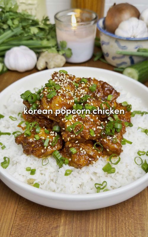 Korean Popcorn Chicken 🍿🍗 For all of you asking about the app, search “Osta” on the app or Google play store ‼️🫶 The crispiest korean porocrn chicken… sweet, spicy and so simple. You can also make this in the air fryer!!🔥 For the Chicken: -2 lb chicken thighs or breasts, cut into 1 inch cubes -2 eggs -2 tbsp rice vinegar -6 garlic cloves, minced -1 tbsp fresh ginger, grated -Seasonings: 2 tsp garlic powder, 2 tsp onion powder, 2 tsp salt, 1 tsp black pepper, 1 tsp gochugaru (optional) -1/4 cup cornstarch -1/2 cup all-purpose flour -Neutral oil, for frying For the Sauce: -1.5 tbsp gochujang -2 tsp sesame seeds -3 tbsp ketchup -4 garlic cloves, minced -1.5 tbsp honey -3 tbsp butter -1 tbsp rice vinegar -1 tbsp soy sauce -2 tsp sesame oil -1 tsp gochugaru (optional) Garnish: -Sesame seeds -Green onions, sliced Instructions: 1. In a bowl, combine chicken with eggs, vinegar, garlic, ginger, & seasonings. Mix well & marinate as long as you wish (1 hour ideal, 1 min works). →For frying: add the cornstarch & flour directly into the same bowl and mix until evenly coated & sticky. →For air frying: do NOT add flour yet. You’ll coat it separately in step 2. 2. For frying: skip this step & go to step 3. For air frying: in a new bowl, mix cornstarch & flour. Remove chicken from marinade then toss in dry ingredients until fully coated. Press lightly so it sticks. 3. For frying: heat neutral oil to 350°F / 175°C. Fry in batches for 7–8 mins until golden and crispy, transfer to a rack. 4. For air frying: oil the basket & spray/brush the chicken with oil. Cook at 375°F for 8 mins, flip, cook for 6–8 mins more until crispy & cooked through. Work in batches. 5. In a pan over medium-low heat, combine gochujang, ketchup, sesame seeds, garlic, honey, rice vinegar, soy sauce, sesame oil, & optional gochugaru. Bring to a simmer, add butter, stir until melted, remove from heat. 6. Add the chicken directly to the sauce & toss OR in a mixing bowl, combine your desired amount of sauce with the chicken to control how saucy it gets. 7. Serve over jasmine rice, garnish with sesame seeds & green onions. Enjoy :) #recipesoftiktok #chicken #Recipe #cookingathometiktoktv 