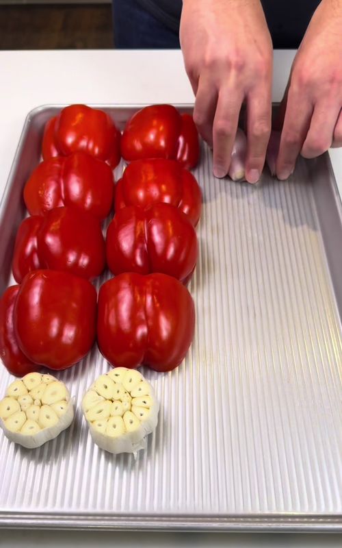 Creamy Roasted Red Pepper & Tomato Pasta 🍝 This is one of those easy dinners that feels way fancier than the effort it takes. Everything roasts on one sheet pan, gets blended into a creamy sauce, and turns into a restaurant quality pasta for a fraction of the cost. If you’re always looking for simple and affordable meals, this one is worth saving. Follow for more easy & affordable homemade meals. Ingredients Vegetables • 4 large red bell peppers, halved and seeded • 2 cups cherry tomatoes (about 1 pint) • 3 shallots, peeled and halved • 2 whole garlic heads, halved horizontally Oil + Seasoning • ⅓ cup olive oil • 1 tsp kosher salt • ½ tsp black pepper • 1 tsp garlic powder • 1 tsp onion powder • 1 tsp dried oregano • ½ tsp dried thyme • 1 tsp smoked paprika • ½ tsp red pepper flakes (optional) Sauce + Pasta • 4 oz cream cheese • ½ cup fresh basil leaves • 12 oz pasta • 1 cup reserved pasta water For Topping • Grated parmesan cheese • Fresh basil leaves Instructions 1. Preheat oven to 425°F (218°C). Add peppers, tomatoes, shallots, and garlic to a sheet pan. Drizzle with olive oil, season with spices, and roast for 30 minutes until soft and slightly charred. 2. Cook pasta in salted water until al dente. Reserve 1 cup pasta water before draining. 3. Squeeze roasted garlic from the skins and add everything from the sheet pan to a blender with cream cheese, basil, and ½ cup pasta water. 4. Blend until smooth and creamy, adding more pasta water if needed. 5. Pour sauce into a large pan over medium heat, add cooked pasta, and toss until fully coated. 6. Top with parmesan and fresh basil before serving. #easydinners #sheetpan #pasta 