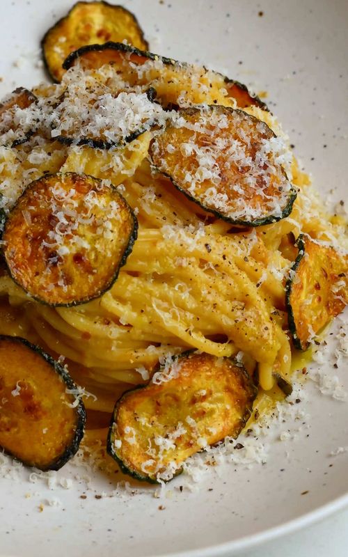 Spaghetti alla Nerano Spaghetti tossed with fried zucchini and a blend of freshly grated cheeses creates one of those dishes that feels almost too simple for how good it is. It’s rich, glossy, and honestly hard to stop eating once you start. I like to make this for special occasions, like Mother’s Day, but it’s just as good when you want to have a special weeknight dinner. #pastalover #weeknightdinner #comfortfood #italianfood #mothersday  Spaghetti alla Nerano, Zucchini Pasta, Easy Italian Dinner, Comfort Food Pasta, Creamy Pasta Without Cream, Weeknight Pasta Recipe, Fried Zucchini Pasta, Simple Italian Recipes, Mother’s Day recipes