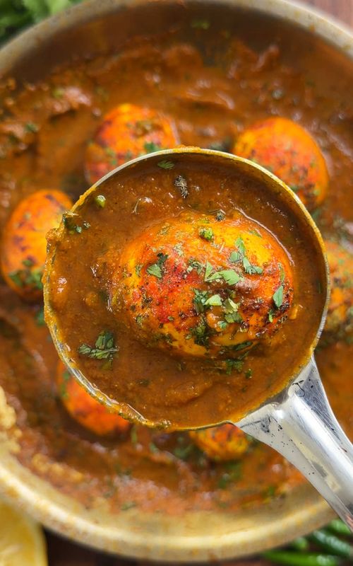 Indian Meals Made Easy:  Simple Egg Curry If you want all my recipes with macros!! Check out my website OR link in bio! The easiest egg curry, just needs a little love and you will be making it multiple times a week…  spicy, tangy, and super simple!! Ingredients:  Eggs: 6-7 eggs 1 tsp red chill powder 1 tsp turmeric Curry Ingredients: 3 tomatoes 2 red onions 2 tbsp ginger garlic paste 3 green chillies (add less if you want less spice) 1.5 tsp salt (adjust if needed) 1 tbsp cumin seeds 2 tsp red chilli powder 2 tsp turmeric 1 tbsp coriander powder 1 tsp garam masala 1 tbsp dried fenugreek leaves (kasoori methi) handful of chopped cilantro 1 cup hot water (add 0.5 cup more if you want it thinner) Now its time to ENJOY!! #homecooking #EasyRecipe #indianfood #amateurprochef 