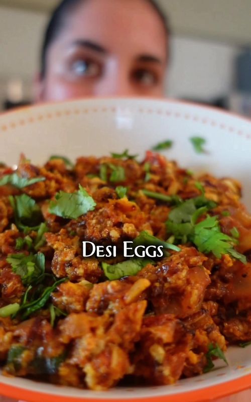 Desi Eggs Recipe 👇🏼 Ingredients: • 2 tbsp oil, butter, or ghee (I use @Nanak Foods ghee) • 1 large white/yellow onion, chopped • 1–1.5 tomatoes, chopped • Thai green chilies (as many or as few as you like) • ½ tbsp red chili powder (adjust to taste) • ½ tbsp cumin seeds • 1 tsp turmeric • Salt to taste • 4 eggs • Cilantro for garnish • Optional: cheese on top Instructions: 1. Place a skillet or cast iron pan on medium-high heat. 2. Add 2 tbsp oil/butter/ghee. 3. Once the oil is hot, add the chopped onions and sauté until they turn translucent and lightly golden. 4. Add in your tomatoes and Thai green chilies. 5. Lower the heat slightly and cook for a few minutes until the tomatoes start to break down and soften. 6. Add your spices: red chili powder, cumin seeds, turmeric, and salt. 7. Keep the heat low and sauté until the oil separates from the masala. 8. Crack in 4 eggs. Cook for 20–30 seconds max so they stay soft and silky (not rubbery!). 9. Optional: sprinkle on some cheese and let it melt. 10. Transfer to a plate, top with fresh cilantro, and enjoy with bread, sourdough, or paratha, plus a cup of chai or coffee. 🫶🏽✨ #DesiEggs #Recipe #PakistaniFood #IndianFood #Deevaandfood 