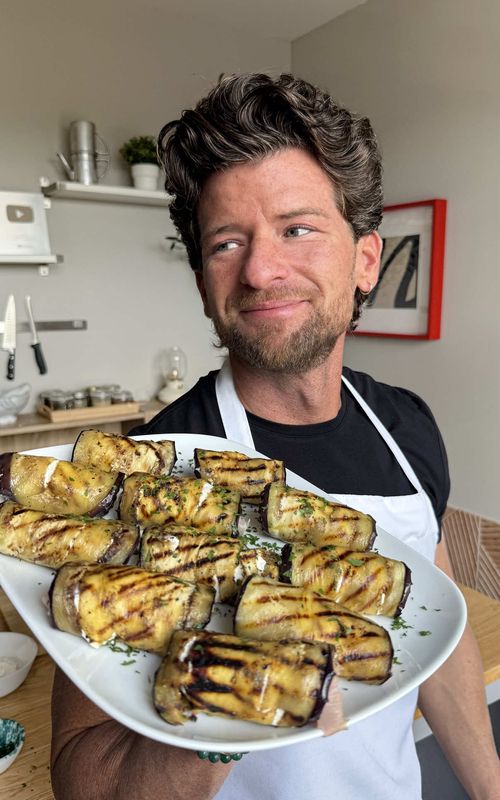Pick up a few eggplants and I’ll show you what to do with them. 🍆🇮🇹 This is a great Easy Eggplant Recipe when you want something fast without spending an hour in the kitchen. It’s perfect for barbecues or when you're having people over, just assemble and serve!  Save this for your next weeknight dinner or summer BBQ!  Ingredients:  Eggplant (Sliced thin lengthwise) Ricotta  Prosciutto Cotto Fresh Parsley Extra Virgin Olive Oil Sea Salt & Black Pepper Directions:  1. Slice the eggplant thin and cook them on a hot grill pan with a drizzle of olive oil, salt, and pepper until they are fully cooked.  2. Lay the slices out and smear with a layer of creamy ricotta followed by a slice of prosciutto cotto. 3. Roll them up tight and arrange them on your platter. 4. Top with plenty of fresh parsley. #eggplant #EasyRecipe #fyp 