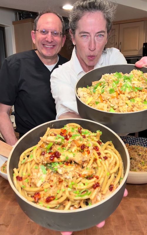 2 Meals:  Rotisserie Chicken Fried Rice & Chili Crisp Scallion Noodles  INGREDIENTS 6–7 cups cooked white rice 1 rotisserie chicken, shredded Juices from chicken bag 6 eggs, scrambled ½ cup scallions, chopped ½ cup butter (1 stick) 12–15 cloves garlic, minced 4–5 tbsp soy sauce 2–3 tsp sesame oil 2 tbsp chili crisp 1 tbsp sesame seeds Salt + pepper ASSEMBLE Melt butter + sauté garlic till fragrant. Big bowl: rice + chicken + eggs. Pour in chicken juices + garlic butter. Add scallions + sauces + seasoning. INGREDIENTS1 box pasta, cooked1 rotisserie chicken, shredded3 carrots, shredded1 cucumber, shredded½ cup scallions, chopped SAUCE (scaled for full box pasta)½ cup creamy peanut butter4–5 tbsp soy sauce1–2 tbsp rice vinegar2–3 tsp sesame oil2–3 tbsp chili crisp1–2 tsp chili flakes3–4 cloves garlic, minced2 tbsp sesame seeds ⅓–½ cup hot oil ASSEMBLEAdd peanut butter + everything (except oil) to bowl.Heat oil till HOT → pour over (sizzle moment).Mix into a sauce.Toss with noodles + chicken + veg. #quickrecipes #dinneridea #friedrice #noodle #easymeal 