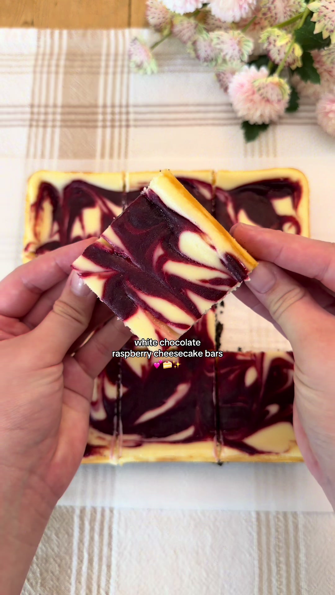 White Chocolate Raspberry Cheesecake Bars 💕🍰 (recipe makes an 8x8 pan) Raspberry Swirl: 1 cup fresh or frozen raspberries  3 tbsp (38g) granulated sugar  ½ tsp lemon juice 1 tsp cornstarch 1 tsp water Crust: 24 oreos, finely crushed ¼ cup (57g) unsalted butter, melted  Filling: 16 oz (454g) cream cheese, softened (block-style, not spreadable) ½ cup (100g) granulated sugar ¼ cup (60g) sour cream, room temp 1 tsp vanilla extract 1 tbsp all-purpose flour 5 oz (142g) white chocolate, melted & slightly cooled 1 egg, room temp  Instructions: Cook raspberries, sugar, and lemon juice in a saucepan over medium heat. Mash the berries as they soften until mixture is juicy and just simmering.  In a small bowl, mix cornstarch and water together, then stir it into the raspberry mixture.  Cook for ~1-2 minutes, until it thickens. Remove from heat. Strain through a fine mesh sieve to remove the seeds (optional but recommended for a smoother swirl). Cover directly with plastic wrap and cool completely before using. Preheat the oven to 325°F (163°C). To make the crust, crush 24 oreos with a food processor or by hand and mix with melted butter.  Press into a parchment lined 8x8 pan and bake for 8-10 minutes. Let it cool. Beat cream cheese and sugar until smooth. Mix in sour cream, vanilla, and flour. Gently mix in the melted white chocolate (make sure it’s not too hot).  Add the egg and mix on low speed or by hand until just combined.  Spread this filling over the cooled crust. Drop spoonfuls of the raspberry mixture on top then gently swirl with a knife or chopstick.  Bake at 325°F (163°C) for 30-40 minutes until the edges are set and the center has just a slight jiggle. Cool for at least 30 minutes at room temp, then chill for 3 hours before slicing. Enjoy! #bakingrecipe #cheesecake #raspberry #whitechocolate #Recipe 