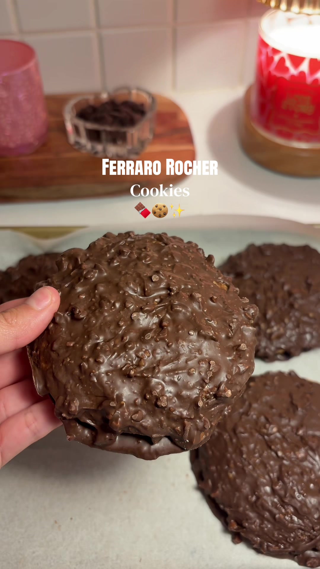 Ferraro rocher cookies 🍫 INGREDIENTS: * 1/2 cup (115g) softened unsalted butter  * 1/4 cup (50g) sugar * 1/2 cup (100g) light brown sugar, packed * 1 3/4 cups (238g) all-purpose flour * 1/4 tsp salt 1.5 g * 1 1/2 tsp baking powder 6 g * 1/4 tsp baking soda 1.2 g * 1 large egg + 1 egg yolk * 1 tsp vanilla extract 4.5 g * 8 oz of melting chocolate 227 g * 1/2 cup chopped roasted hazelnuts * Nutella & white hazelnut spread(for filling) 55-60 g  Instructions: INSTRUCTIONS: Scoop small dollops of Nutella and hazelnut spread onto a plate (or spoon it into rounds). Freeze until solid. In a medium bowl, cream together the cold butter, caster sugar, and brown sugar until well combined and slightly fluffy. Mix in the egg, egg yolk, and vanilla extract until smooth. Add in the flour, salt, baking powder, and baking soda. Mix just until a dough forms (don’t overmix). Let the dough chill slightly, then fold in the hazelnut spread and Nutella mixture pieces. In a separate bowl, melt your chocolate until smooth, then stir in the chopped roasted hazelnuts until fully combined. Bake at 350°F (175°C) for 8–10 minutes, until edges are set but the center is still soft. Once cookies are chilled, spoon a small circle layer of the melted chocolate hazelnut coating onto parchment or a tray. Place each cookie on top of the chocolate circle. Pour or spoon the remaining chocolate over the top of each cookie, fully coating and sealing it. Let set until the chocolate firms up and enjoy! #cookies #ferrarorocher #nutella #baking #recipes 