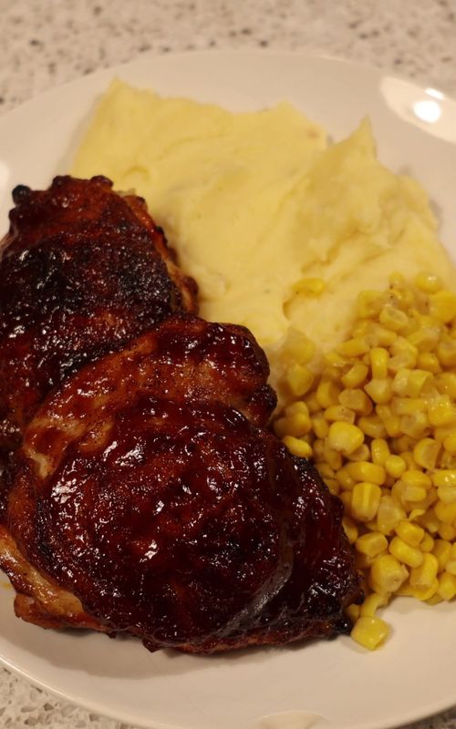 Oven-Baked BBQ Chicken (Easy Dinner We Make on Repeat) This is one of those simple, comforting dinners that never gets old. It’s easy to prep, uses pantry staples, and always turns out tender, juicy, and full of flavor. BBQ Rub (makes extra for future meals): 1/4 cup brown sugar 1 tablespoon paprika 1 tablespoon black pepper 1 tablespoon kosher salt 1 tablespoon garlic powder 1/4 teaspoon cayenne pepper Mix everything together and store any extra in an airtight container in your pantry. For the Chicken: Bone-in, skin-on chicken thighs BBQ rub (above) Your favorite BBQ sauce Instructions: Preheat oven to 400°F. Pat chicken thighs dry and coat generously on both sides with the BBQ rub. Place chicken on a baking sheet or in a baking dish. Bake for 40 minutes. Remove from the oven and brush BBQ sauce over both sides of the chicken. Return to the oven and continue baking for another 20–30 minutes, brushing with more sauce every 5–10 minutes, until the chicken is cooked through and nicely caramelized. Let rest for a few minutes before serving. Serve with: Mashed potatoes and a simple veggie. We love it with corn.
