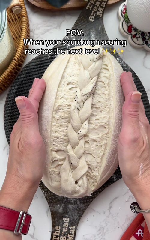 Making a braid on a sourdough loaf. Scoring and decorating the loaf is my favorite part of the process ☺️ #sourdough #sourdoughbread #sourdoughscoring #bakedsourdough #sourdoughbaking      