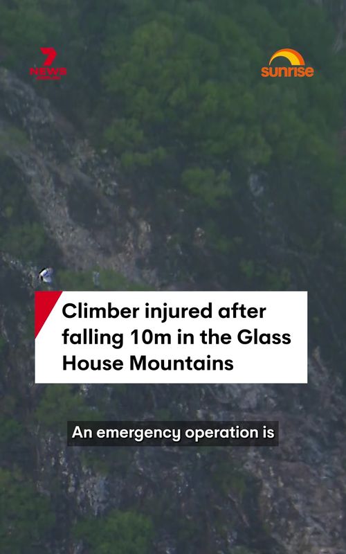 An emergency rescue operation is underway in the Glasshouse Mountains north of Brisbane after a climber fell 10 metres down a rock face. The climber has been left with minor injuries following the fall in the popular Sunshine Coast climbing area. Emergency crews are on the ground this morning working to reach the patient and safely extract them from the mountainous terrain. Aerial footage from the 7NEWS helicopter shows climbers in the area, though it’s not yet confirmed if they are linked to the urgent rescue mission. #climber #mountain #fall #emergency #glasshousemountains